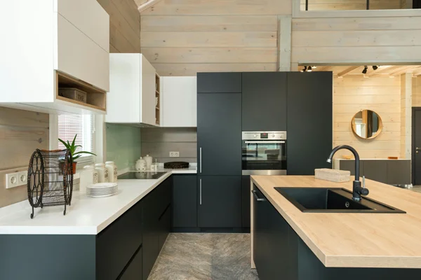 A black and white modern kitchen with sleek lines that shows one of the frequently asked questions about kitchen upgrades