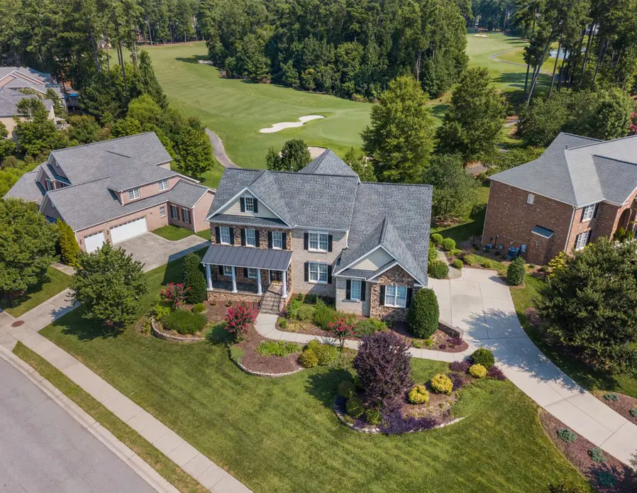 Aerial view of neighborhood homes on a golf course